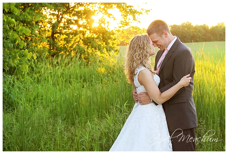 Bride and Groom photos in field at sunset in wisconsin